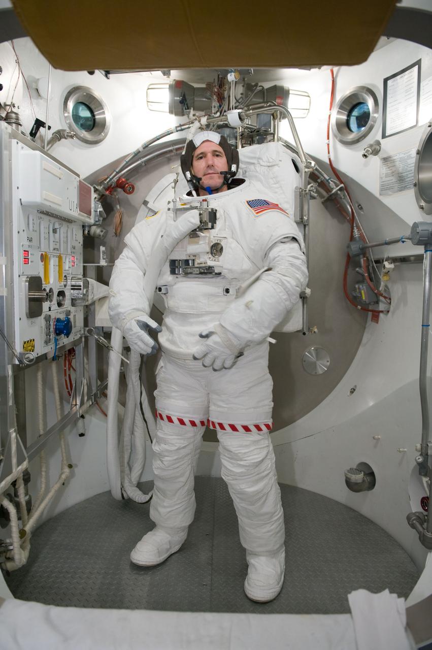 JSC2010-E-026888 (26 Feb. 2010) --- NASA astronaut Michael Good, STS-132 mission specialist, participates in an Extravehicular Mobility Unit (EMU) spacesuit fit check in the Space Station Airlock Test Article (SSATA) in the Crew Systems Laboratory at NASA's Johnson Space Center.