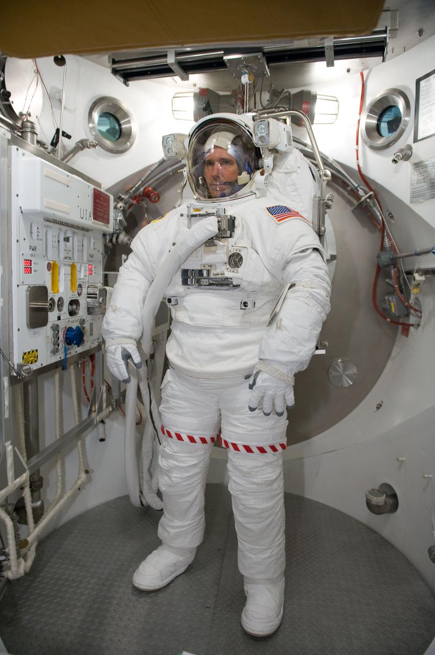 JSC2010-E-026895 (26 Feb. 2010) --- NASA astronaut Michael Good, STS-132 mission specialist, participates in an Extravehicular Mobility Unit (EMU) spacesuit fit check in the Space Station Airlock Test Article (SSATA) in the Crew Systems Laboratory at NASA's Johnson Space Center.