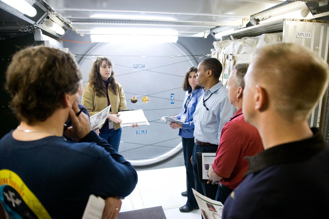 JSC2010-E-026906 (22 Feb. 2010) --- STS-133 crew members participate in a training session in an International Space Station mock-up/trainer in the Space Vehicle Mock-up Facility at NASA's Johnson Space Center. Pictured counter-clockwise (from the right foreground) are NASA astronauts Tim Kopra, mission specialist; Steve Lindsey, commander; Alvin Drew, Nicole Stott and Michael Barratt (left foreground), all mission specialists.