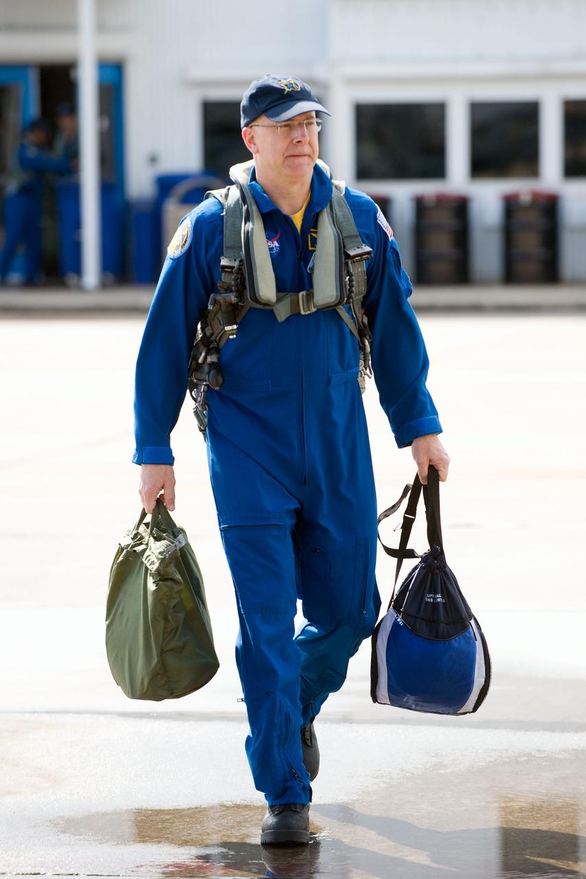 JSC2010-E-032819 (1 March 2010) --- NASA astronaut Alan Poindexter, STS-131 commander, walks to the nearby flight line of NASA T-38 trainer jets at Ellington Field near NASA's Johnson Space Center prior to a flight to Kennedy Space Center, Florida.