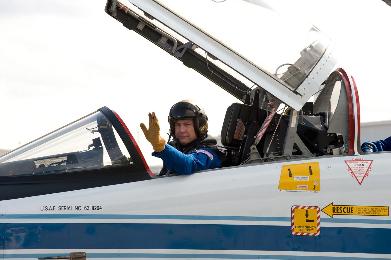 JSC2010-E-032829 (1 March 2010) --- NASA astronaut Alan Poindexter, STS-131 commander, waves as he prepares to leave for a flight in a NASA T-38 trainer jet from Ellington Field near NASA?s Johnson Space Center to Kennedy Space Center, Florida.