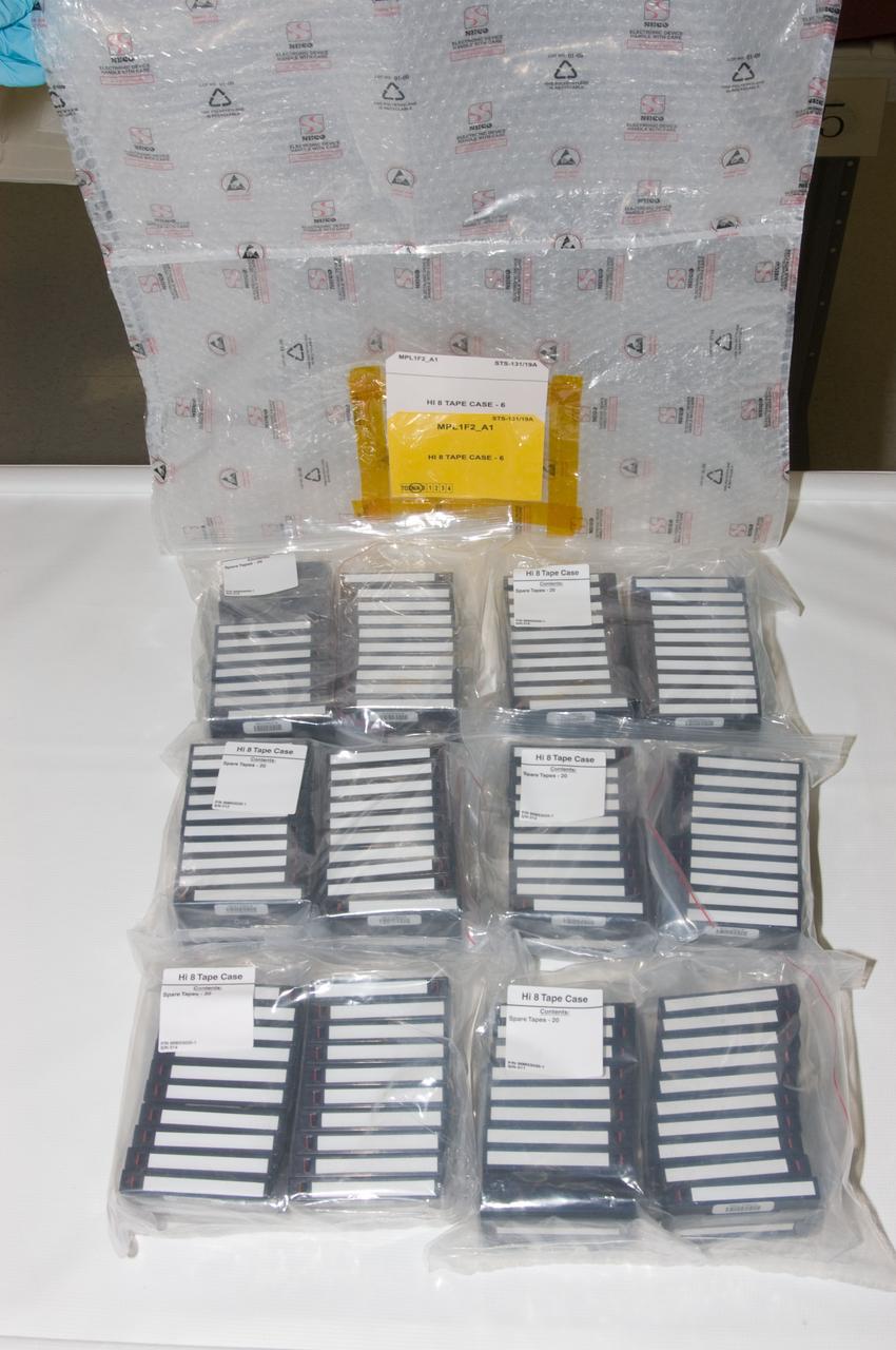 View of a Hi 8 Video Storage Bag and multiple Hi 8 Video Tape cases.