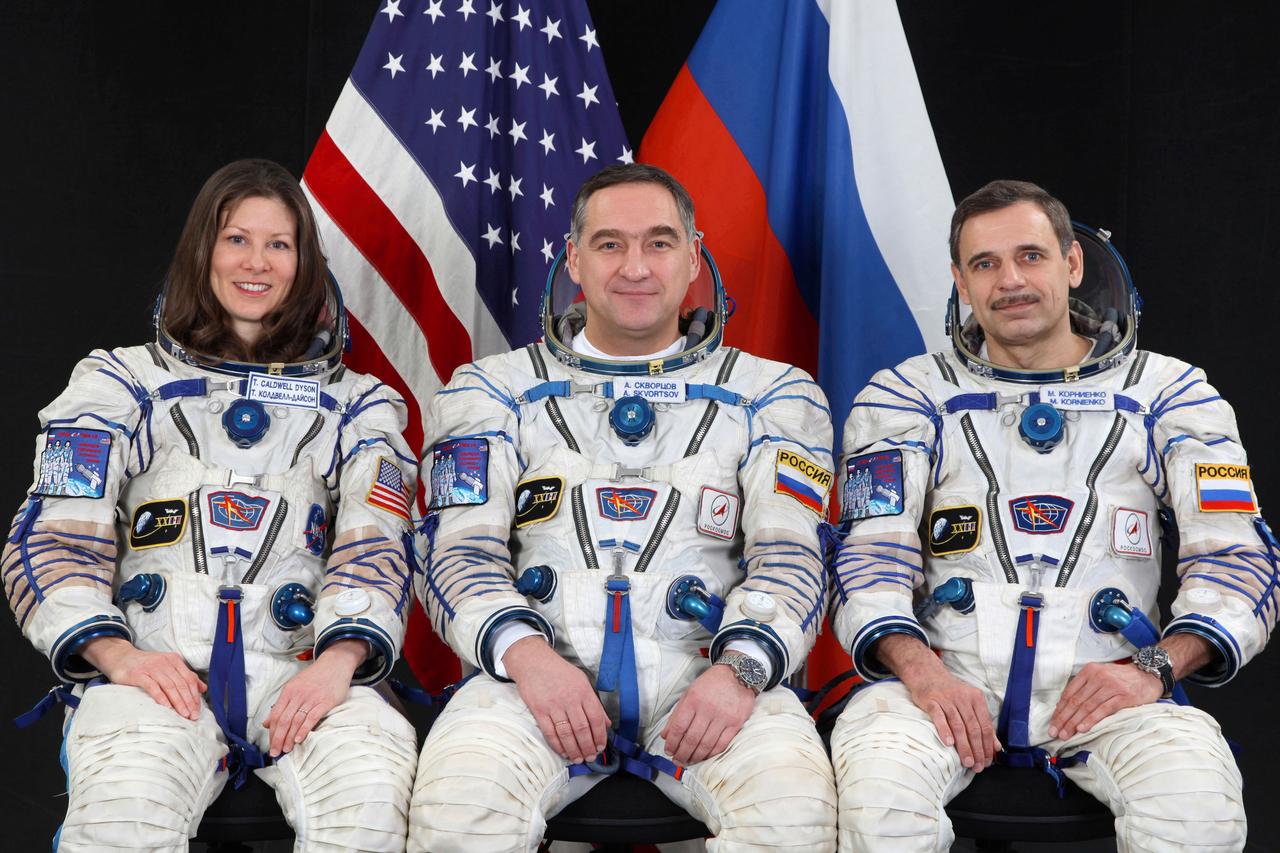 JSC2010-E-038788 (March 2010)  --- From the left, NASA astronaut Tracy Caldwell Dyson,  along with Russian cosmonauts Alexander Skvortsov and Mikhail Kornienko take a break in Expedition 23 training to pose for a crew portrait. Photo Credit: Roscosmos/Gagarin Cosmonaut Training Center.
