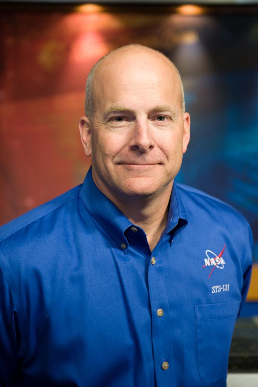 JSC2010-E-038822 (9 March 2010) --- NASA astronaut Alan Poindexter, STS-131 mission commander, poses for photos during the press day event for the scheduled April mission. NASA astronauts Poindexter and James Dutton will serve as the mission commander and pilot, respectively. They will be joined by astronauts Clayton Anderson, Rick Mastracchio, Dorothy Metcalf-Lindenburger and Stephanie Wilson, along with Naoko Yamazaki of the Japan Aerospace Exploration Agency, all mission specialists.
