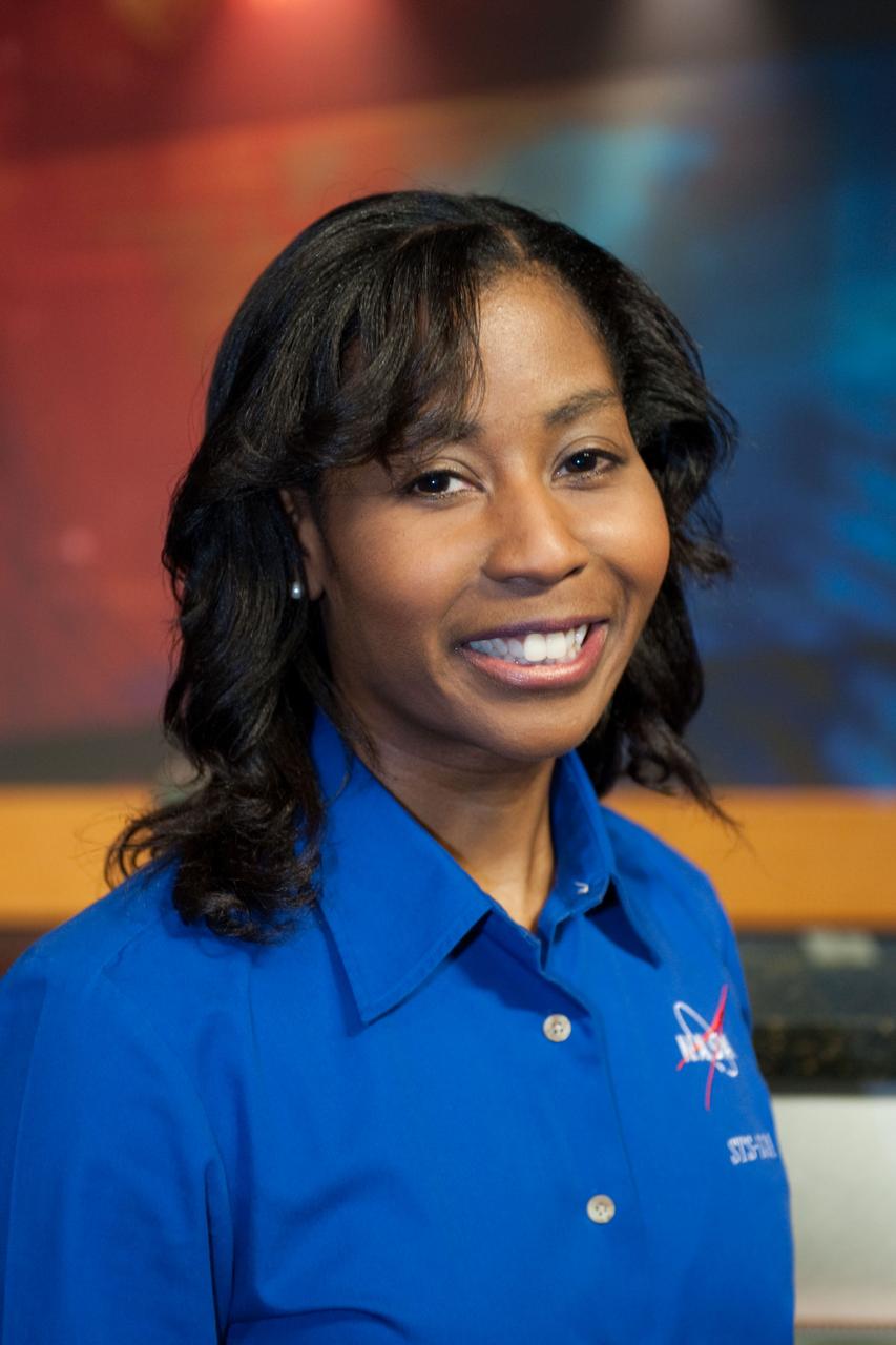 JSC2010-E-038825 (9 March 2010) --- NASA astronaut  Stephanie Wilson, STS-131 mission specialist, poses for photos during the press day event for the scheduled April mission. NASA astronauts Alan Poindexter and James Dutton will serve as the mission commander and pilot, respectively. They will be joined by astronauts Clayton Anderson, Rick Mastracchio, Dorothy Metcalf-Lindenburger and  Wilson, along with Naoko Yamazaki of the Japan Aerospace Exploration Agency, all mission specialists.