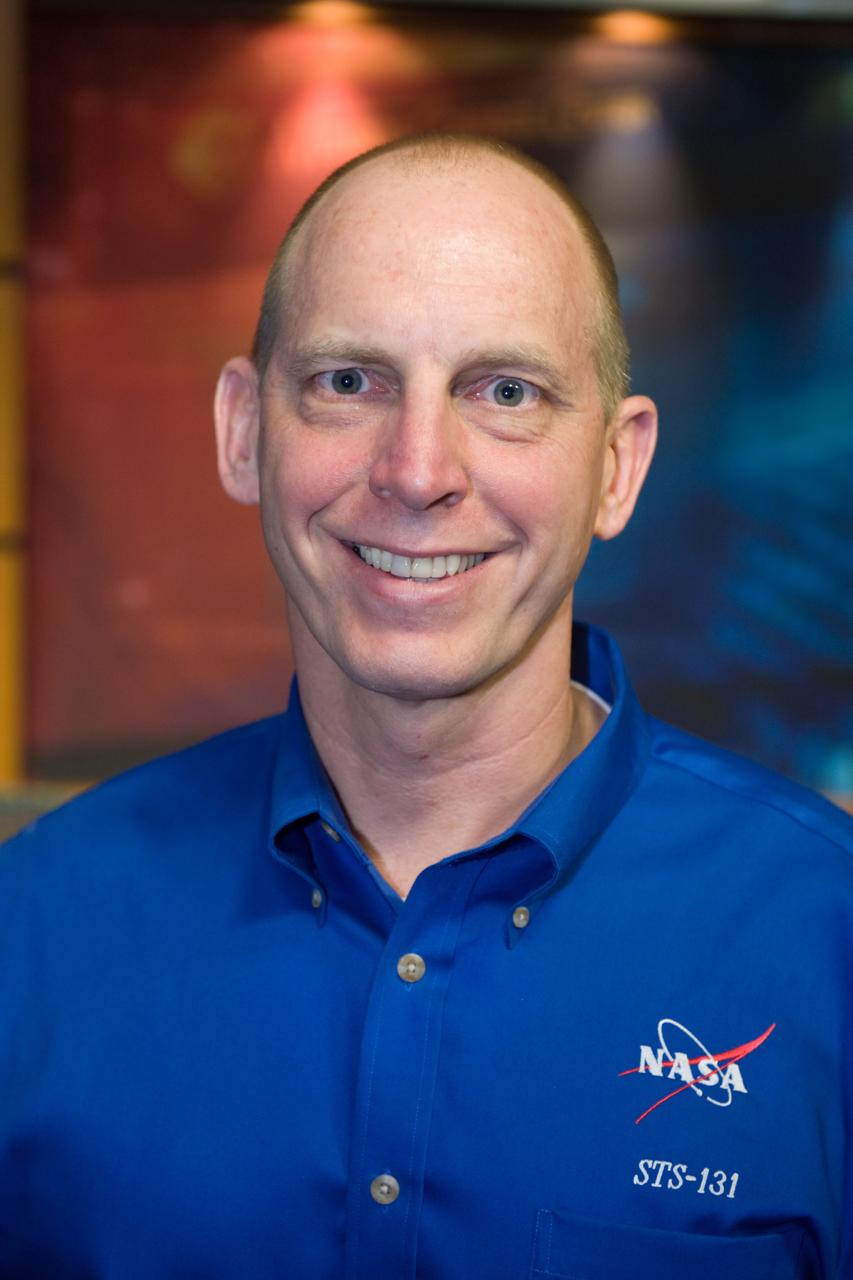 JSC2010-E-038827 (9 March 2010) --- NASA astronaut Clayton Anderson, STS-131 mission specialist, poses for photos during the  press day event for the scheduled April mission. NASA astronauts  Alan Poindexter and James Dutton will serve as the mission commander and pilot, respectively. They will be joined by astronauts Anderson, Rick Mastracchio, Dorothy Metcalf-Lindenburger  and Stephanie Wilson along with Naoko Yamazaki of the Japan Aerospace Exploration Agency, all mission specialists.