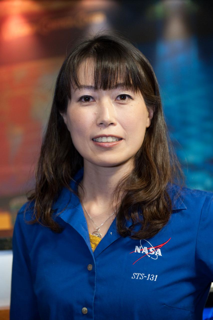 JSC2010-E-038828 (9 March 2010) --- Japan Aerospace Exploration Agency astronaut Naoko Yamazaki, STS-131 mission specialist, poses for photos during the press day event for the scheduled April mission. NASA astronauts  Alan Poindexter and James Dutton will serve as the mission commander and pilot, respectively. They will be joined by astronauts Clayton Anderson, Rick Mastracchio, Dorothy Metcalf-Lindenburger  and Stephanie Wilson along with Yamazaki, all mission specialists.