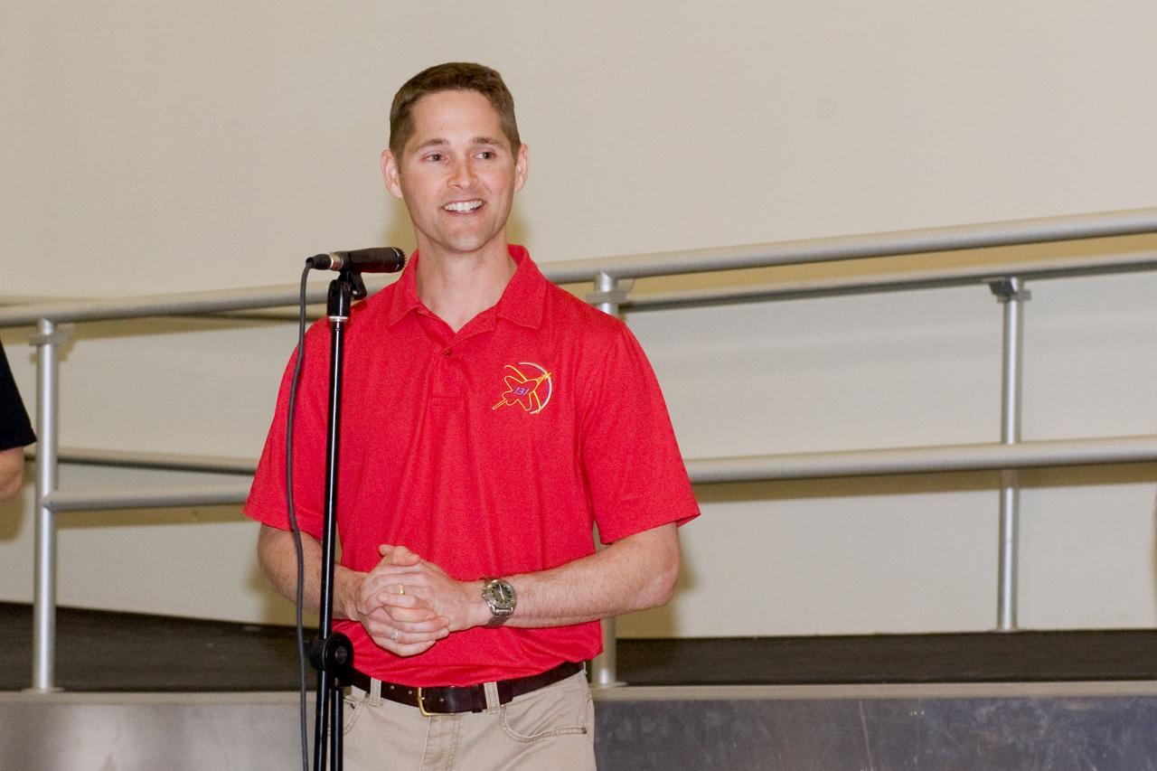 JSC2010-E-039288 (10 March 2010) --- NASA astronaut James P. Dutton Jr., STS-131 pilot, speaks to a crowd during a cake-cutting ceremony in the Jake Garn Simulation and Training Facility at NASA's Johnson Space Center.