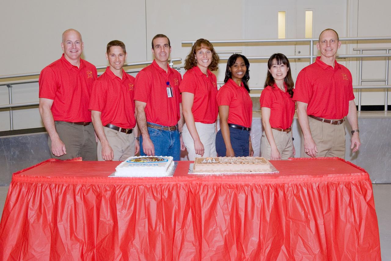 JSC2010-E-039298 (10 March 2010) --- The STS-131 crew members pose for a photo during a cake-cutting ceremony in the Jake Garn Simulation and Training Facility at NASA's Johnson Space Center. Pictured from the left are NASA astronauts Alan Poindexter, commander; James P. Dutton Jr., pilot; Rick Mastracchio, Dorothy Metcalf-Lindenburger, Stephanie Wilson, Japan Aerospace Exploration Agency?s Naoko Yamazaki and NASA astronaut Clayton Anderson, all mission specialists.