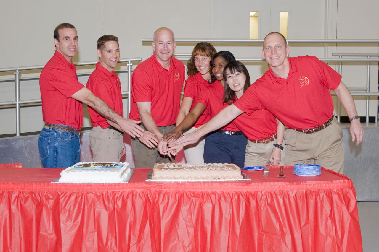 JSC2010-E-039299 (10 March 2010) --- The STS-131 crew members pose for a photo during a cake-cutting ceremony in the Jake Garn Simulation and Training Facility at NASA's Johnson Space Center. Pictured from the left are NASA astronauts Rick Mastracchio, mission specialist; James P. Dutton Jr., pilot; Alan Poindexter, commander; Dorothy Metcalf-Lindenburger, Stephanie Wilson, Japan Aerospace Exploration Agency?s Naoko Yamazaki and NASA astronaut Clayton Anderson, all mission specialists.