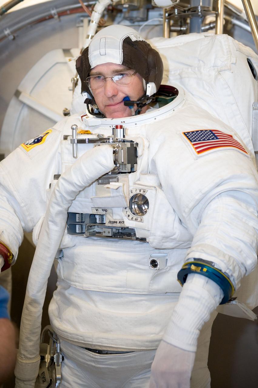 JSC2010-E-039450 (10 March 2010) --- NASA astronaut Steve Bowen, STS-132 mission specialist, participates in an Extravehicular Mobility Unit (EMU) spacesuit fit check in the Space Station Airlock Test Article (SSATA) in the Crew Systems Laboratory at NASA's Johnson Space Center.
