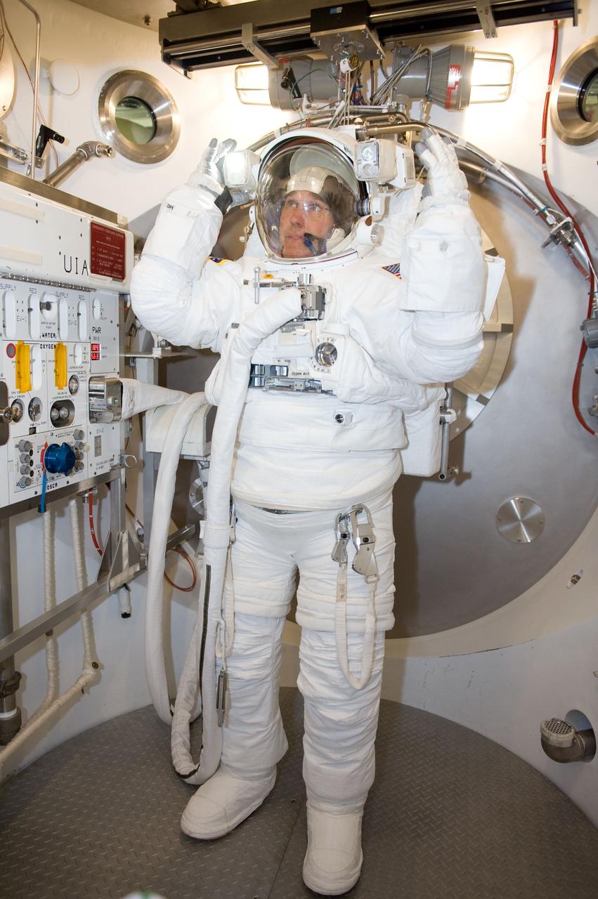 JSC2010-E-039462 (10 March 2010) --- NASA astronaut Steve Bowen, STS-132 mission specialist, participates in an Extravehicular Mobility Unit (EMU) spacesuit fit check in the Space Station Airlock Test Article (SSATA) in the Crew Systems Laboratory at NASA's Johnson Space Center.
