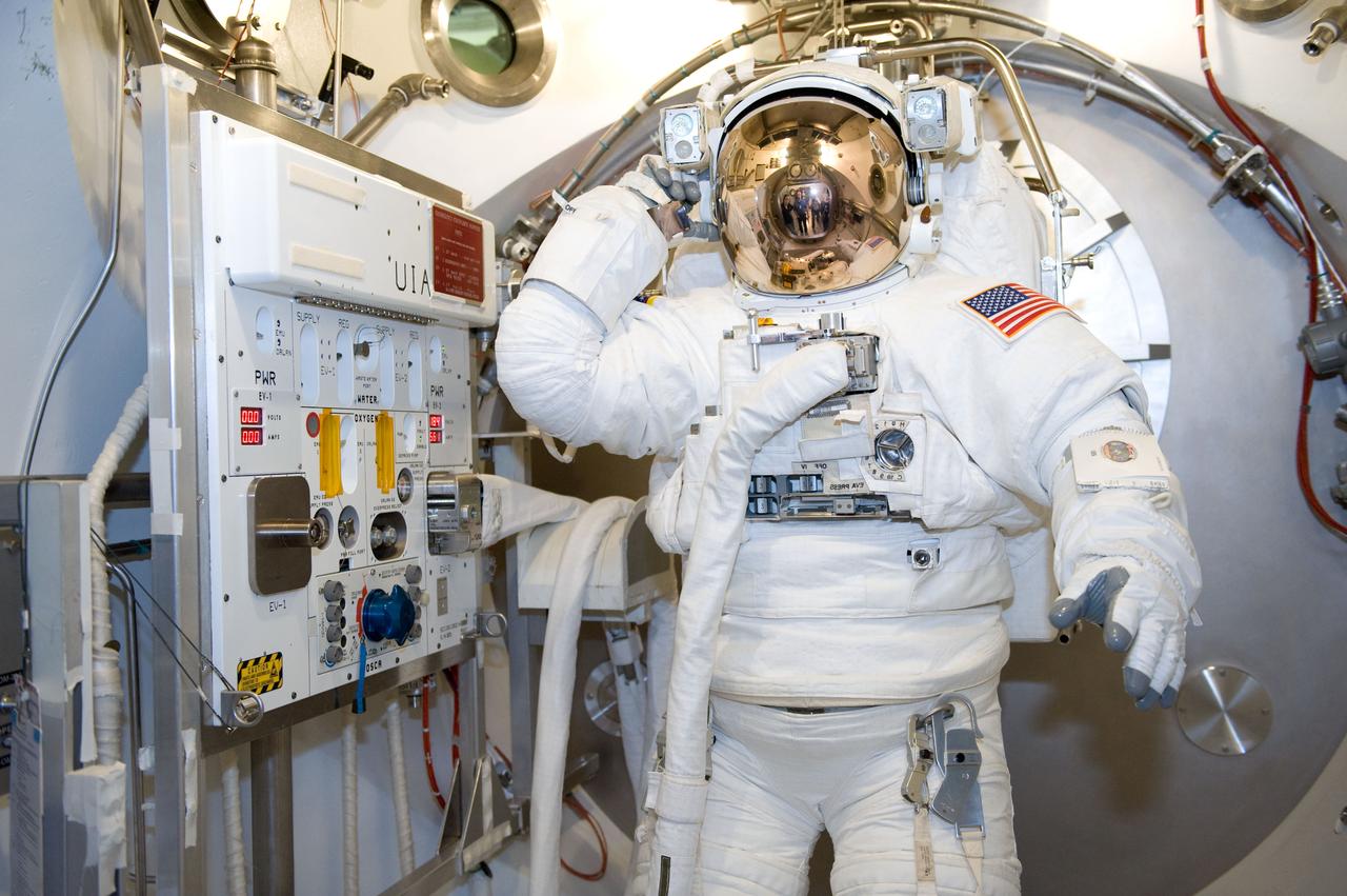 JSC2010-E-039464 (10 March 2010) --- NASA astronaut Steve Bowen, STS-132 mission specialist, participates in an Extravehicular Mobility Unit (EMU) spacesuit fit check in the Space Station Airlock Test Article (SSATA) in the Crew Systems Laboratory at NASA's Johnson Space Center.
