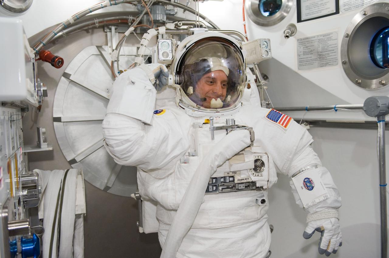 JSC2010-E-041268 (17 March 2010) --- NASA astronaut Garrett Reisman, STS-132 mission specialist, participates in an Extravehicular Mobility Unit (EMU) spacesuit fit check in the Space Station Airlock Test Article (SSATA) in the Crew Systems Laboratory at NASA's Johnson Space Center.
