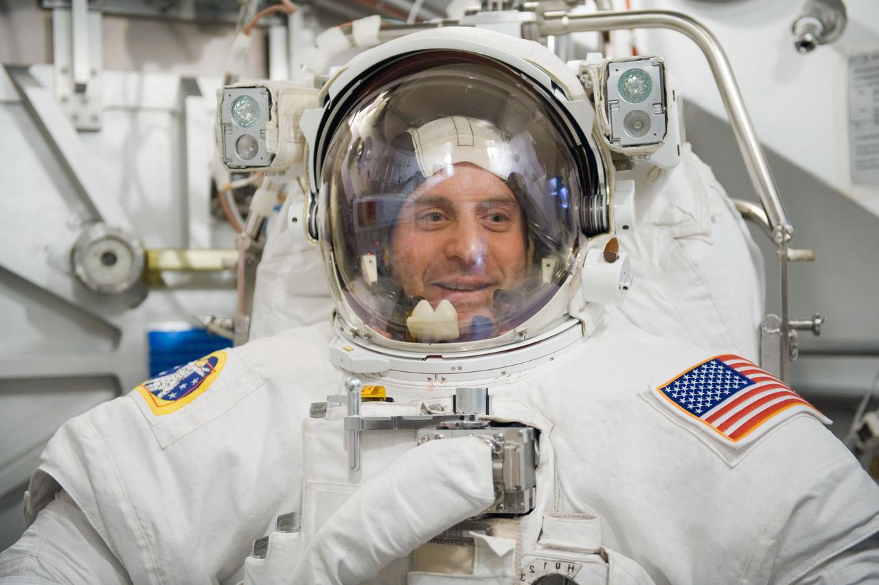 JSC2010-E-041277 (17 March 2010) --- NASA astronaut Garrett Reisman, STS-132 mission specialist, participates in an Extravehicular Mobility Unit (EMU) spacesuit fit check in the Space Station Airlock Test Article (SSATA) in the Crew Systems Laboratory at NASA's Johnson Space Center.