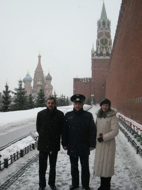 JSC2010-E-041316 (19 March 2010) --- At the Kremlin Wall in Red Square in Moscow March 19, 2010, Russian cosmonaut Mikhail Kornienko (left), Expedition 23 flight engineer;  Russian cosmonaut Alexander Skvortsov   (center), Soyuz commander,  and NASA astronaut Tracy Caldwell Dyson, Expedition 23 flight engineer, brave the elements after laying flowers in a traditional ceremony prior to their departure for the launch site at the Baikonur Cosmodrome in Kazakhstan for final preparations for launch on the Soyuz TMA-18 spacecraft to the International Space Station April 2.  Photo credit: NASA/Stephanie Stoll