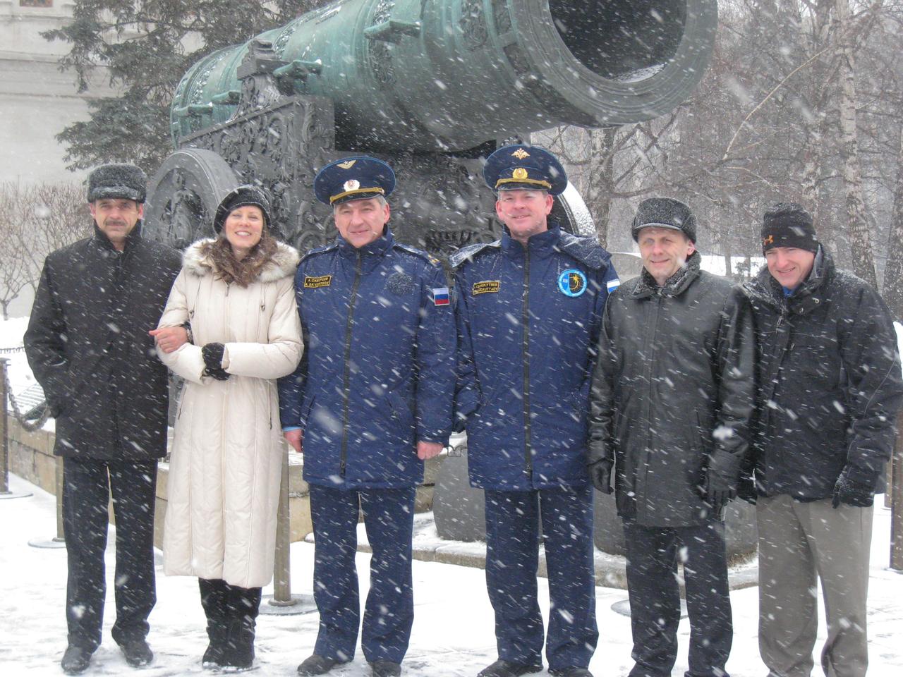 JSC2010-E-041317 (19 March 2010) --- Braving the elements, the prime and backup crews preparing for launch to the International Space Station take a moment to pose for pictures at the Kremlin Wall in Moscow March 19, 2010 as part of their traditional pre-launch ceremonial activities. From left to right are Russian cosmonaut Mikhail Kornienko and NASA astronaut Tracy Caldwell Dyson, both flight engineers for Expedition 23, Russian cosmonaut Alexander Skvortsov, Soyuz commander, and their backups--Alexander Samokutyaev, Andrey Borisenko and Scott Kelly. Skvortsov, Caldwell Dyson and Kornienko will launch in the Soyuz TMA-18 spacecraft from the Baikonur Cosmodrome April 2 and dock to the station April 4. Credit: NASA/Stephanie Stoll