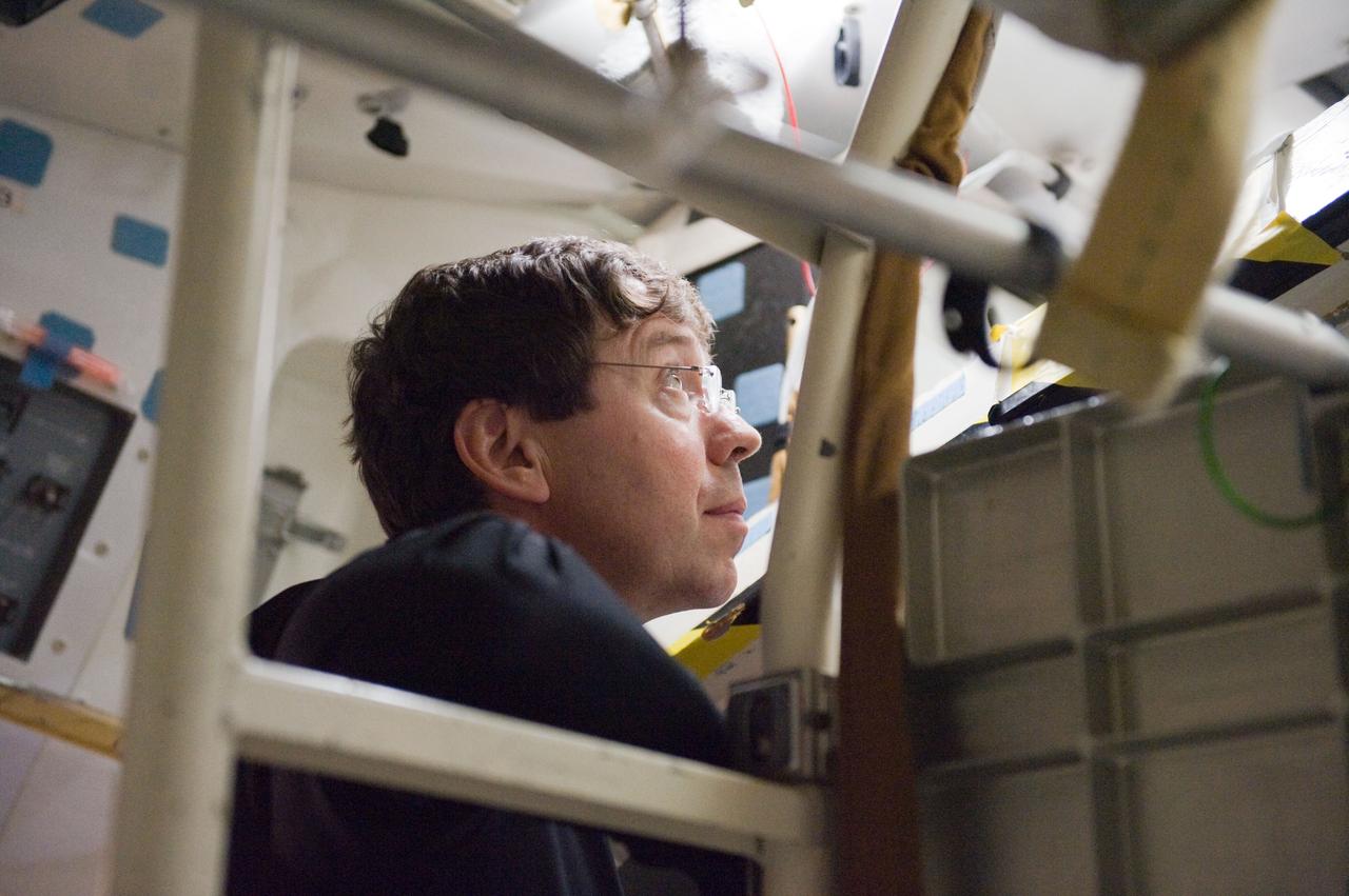 JSC2010-E-042098 (23 March 2010) --- NASA astronaut Michael Barratt, STS-133 mission specialist, participates in a post insertion/de-orbit training session in the crew compartment trainer (CCT-2) in the Space Vehicle Mockup Facility at NASA's Johnson Space Center.
