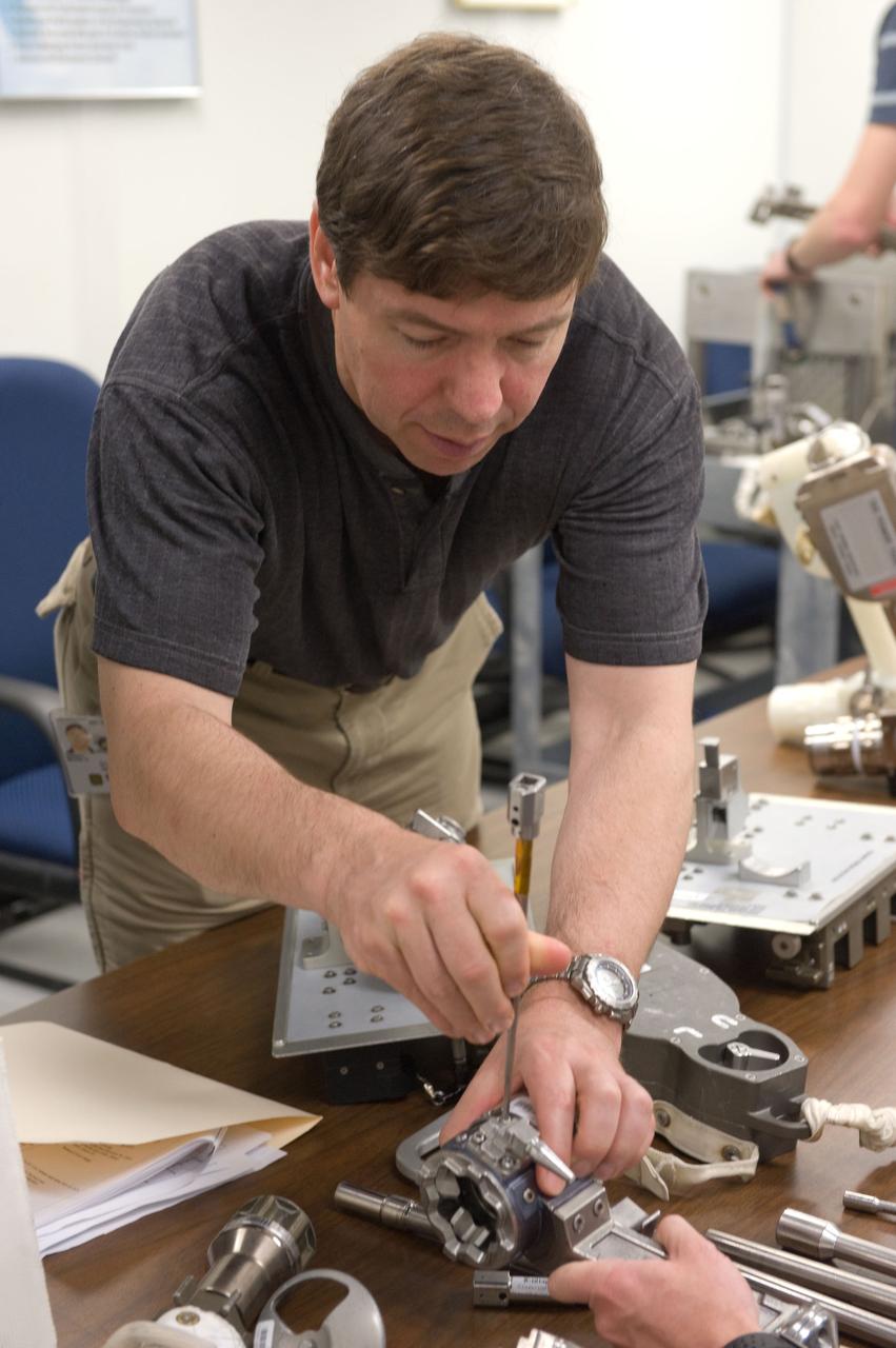 JSC2010-E-042737 (25 March 2010) --- NASA astronaut Michael Barratt, STS-133 mission specialist, participates in an ISS small tools training session in the Neutral Buoyancy Laboratory (NBL) near NASA's Johnson Space Center.