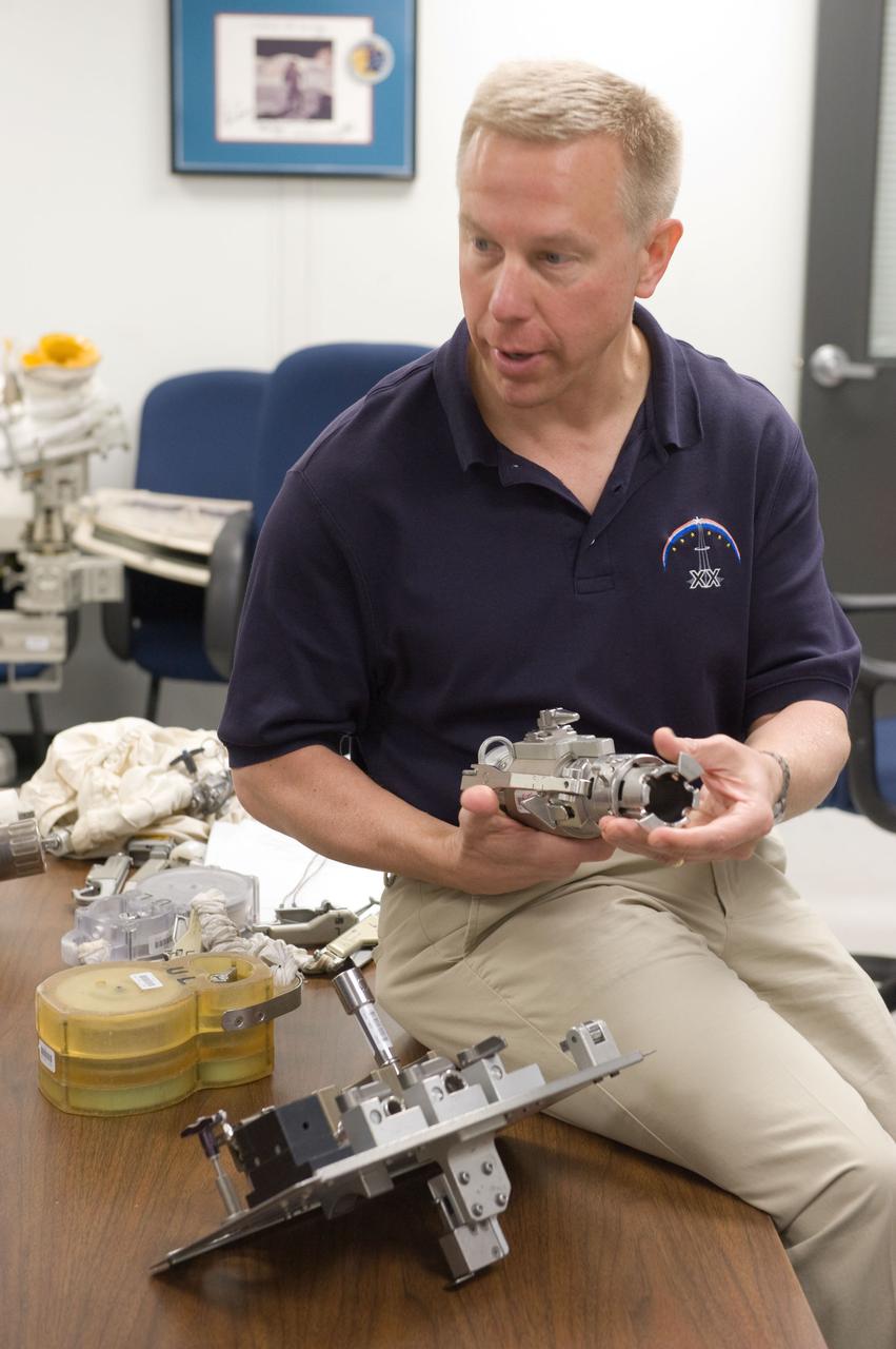 JSC2010-E-042739 (25 March 2010) --- NASA astronaut Tim Kopra, STS-133 mission specialist, participates in an ISS small tools training session in the Neutral Buoyancy Laboratory (NBL) near NASA's Johnson Space Center.