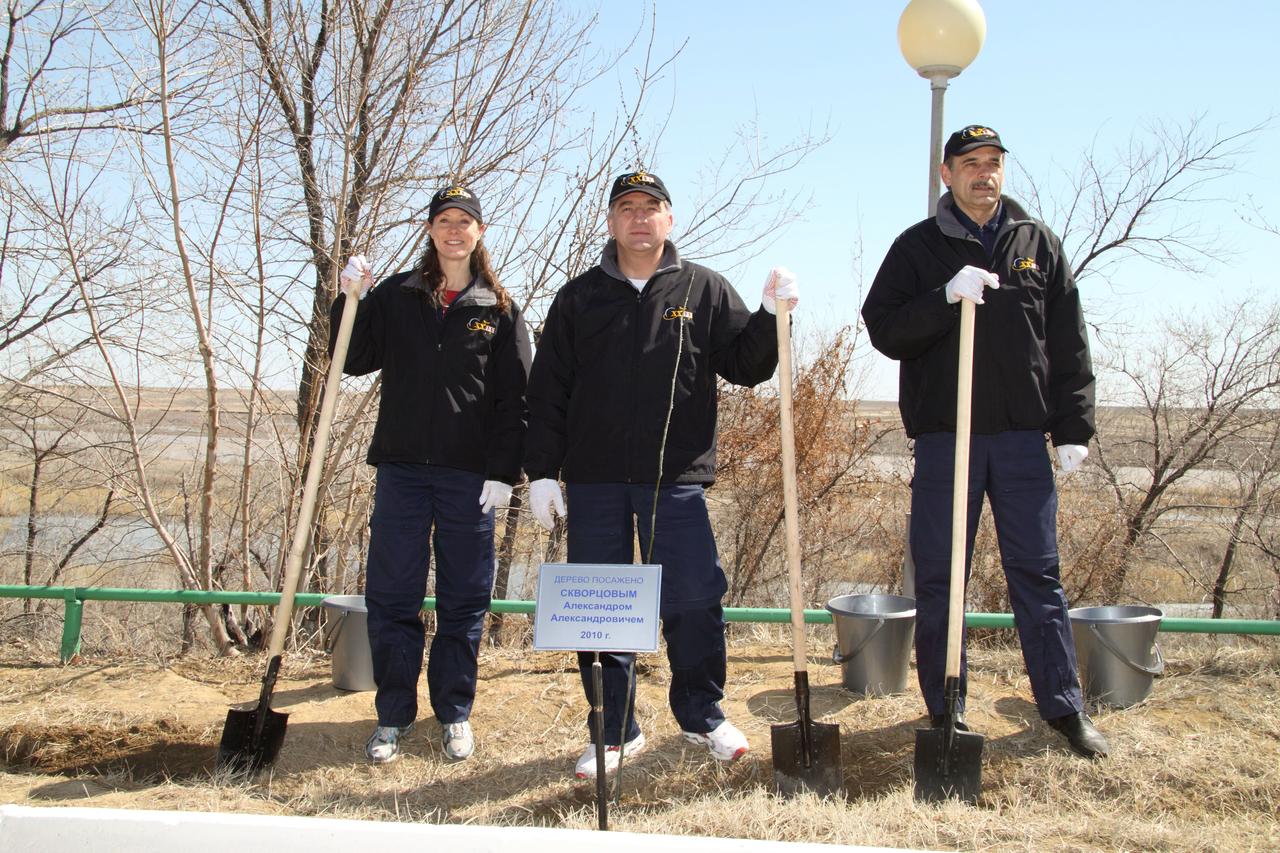 crew paticipating in traditional tree planting outside Cosmonaut hotel