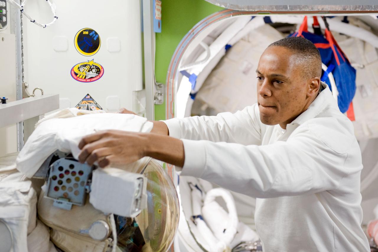 JSC2010-E-044343 (29 March 2010) --- NASA astronaut Alvin Drew, STS-133 mission specialist, participates in a training session in an International Space Station mock-up/trainer in the Space Vehicle Mock-up Facility at NASA's Johnson Space Center.