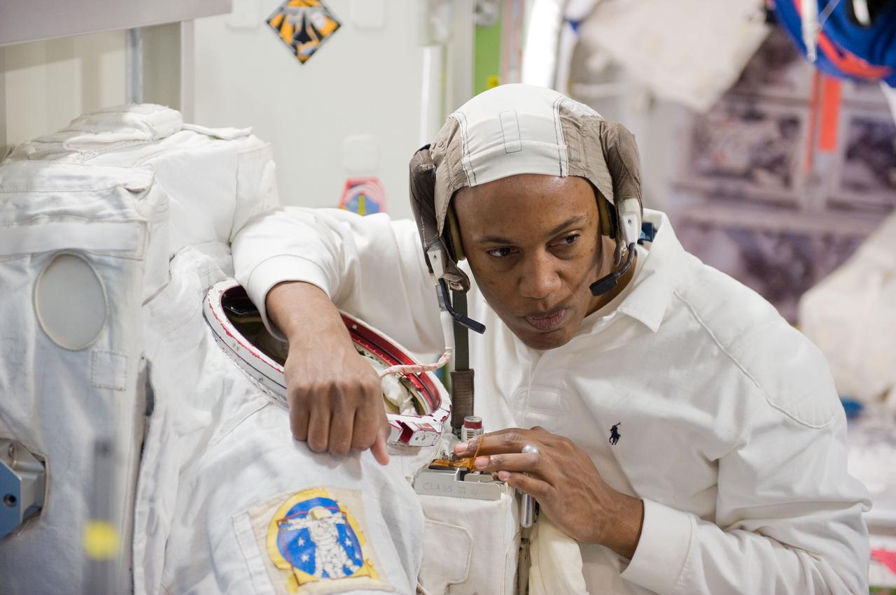 JSC2010-E-044348 (29 March 2010) --- NASA astronaut Alvin Drew, STS-133 mission specialist, participates in a training session in an International Space Station mock-up/trainer in the Space Vehicle Mock-up Facility at NASA's Johnson Space Center.
