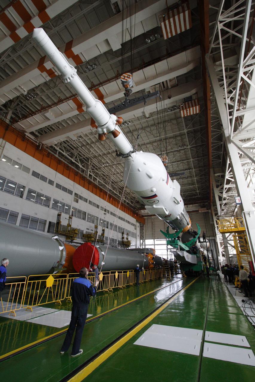 JSC2010-E-044363 (30 March 2010) --- In preparation for an April 2 liftoff for Expedition 23, the final assembly for Soyuz TMA-18 was performed March 30 by TsSKB-Progress personnel in the Launch Vehicle Assembly facility at Site 112 of Baikonur Cosmodrome. Photo credit: NASA/Victor Zelentsov