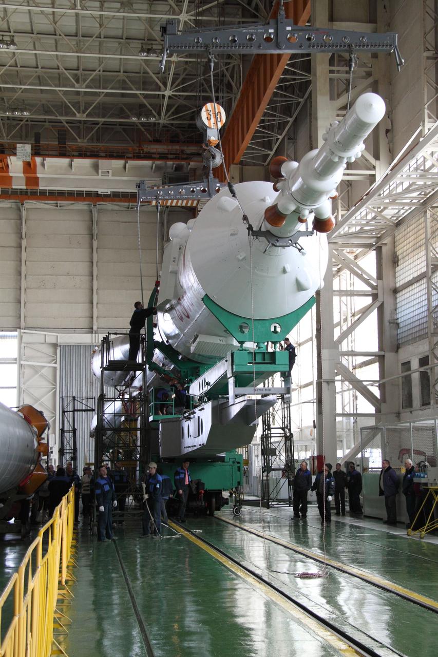 JSC2010-E-044366 (30 March 2010) --- In preparation for an April 2 liftoff for Expedition 23, the final assembly for Soyuz TMA-18 was performed March 30 by TsSKB-Progress personnel in the Launch Vehicle Assembly facility at Site 112 of Baikonur Cosmodrome. Photo credit: NASA/Victor Zelentsov