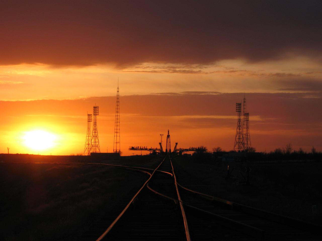 The launch pad at the Baikonur Cosmodrome in Kazakhstan is illuminated at sunrise in the Central Asian desert as it awaits the arrival of the Soyuz TMA-18 vehicle March 31, 2010 which was transported from its assembly hangar to the pad by railcar at dawn. Expedition 23 crewmates Alexander Skvortsov, Mikhail Kornienko and Tracy Caldwell Dyson will launch from Baikonur April 2 en route to the International Space Station.