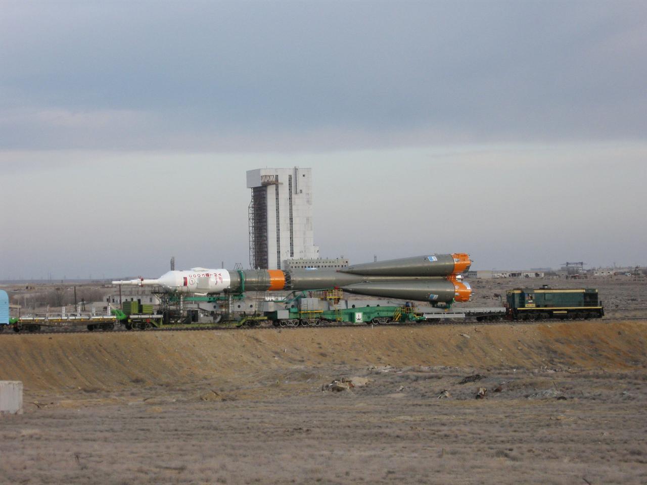 The Soyuz TMA-18 spacecraft and its booster rocket are hauled to the launch pad through the barren Baikonur Cosmodrome in Kazakhstan March 31, 2010 for launch April 2 to transport Expedition 23 crewmates Alexander Skvortsov, Mikhail Kornienko and Tracy Caldwell Dyson to the International Space Station.
