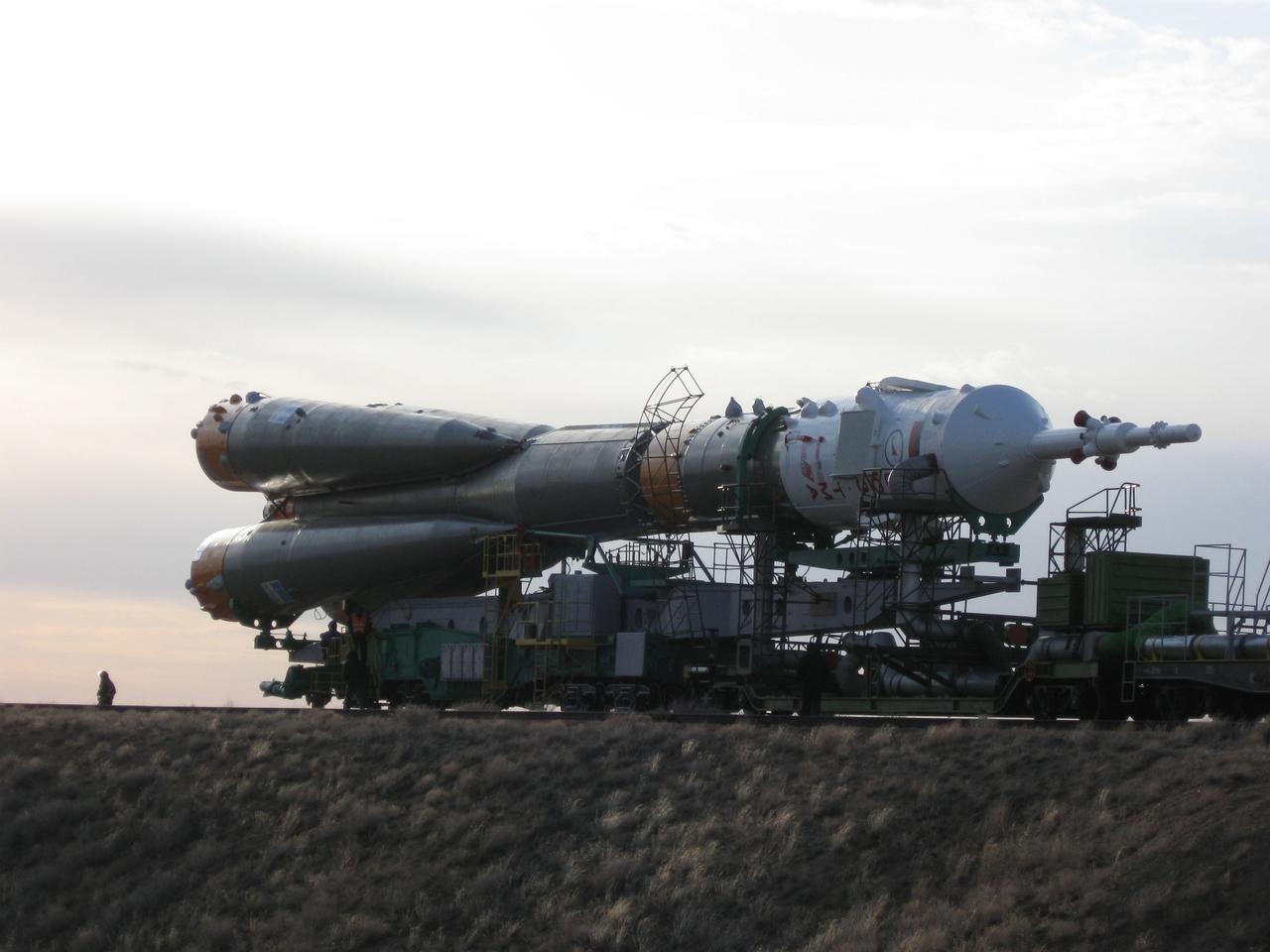 The Soyuz TMA-18 spacecraft and its booster rocket are hauled to the launch pad through the barren Baikonur Cosmodrome in Kazakhstan March 31, 2010 for launch April 2 to transport Expedition 23 crewmates Alexander Skvortsov, Mikhail Kornienko and Tracy Caldwell Dyson to the International Space Station.