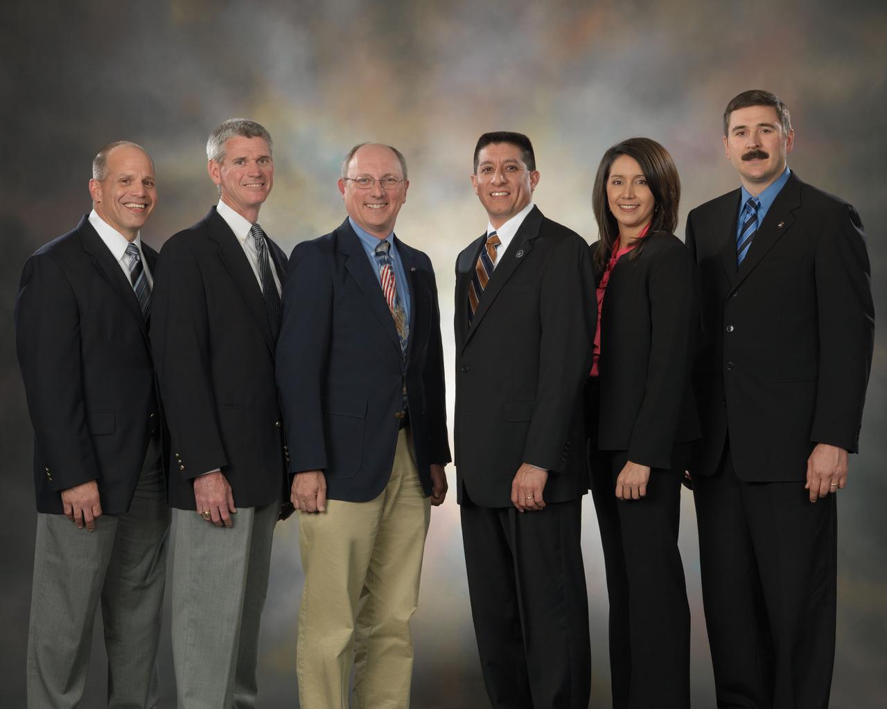JSC2010-E-045167 (30 March 2010) --- Flight directors for the STS-131/19A mission pose for a preflight group portrait at NASA's Johnson Space Center. Pictured from the left are Tony Ceccacci, Bryan Lunney, Paul Dye, Richard Jones, Ginger Kerrick and Mike Sarafin.