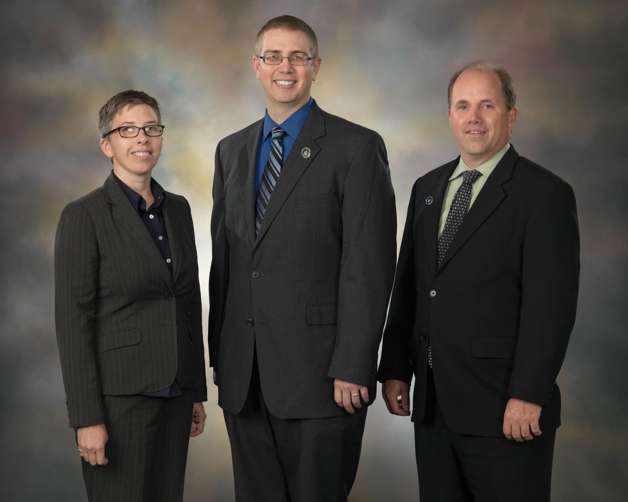 JSC2010-E-045168 (30 March 2010) --- ISS flight directors for the STS-131/19A mission pose for a preflight group portrait at NASA's Johnson Space Center. Pictured from the left are Courtenay McMillan, Ed Van Cise and Ron Spencer.