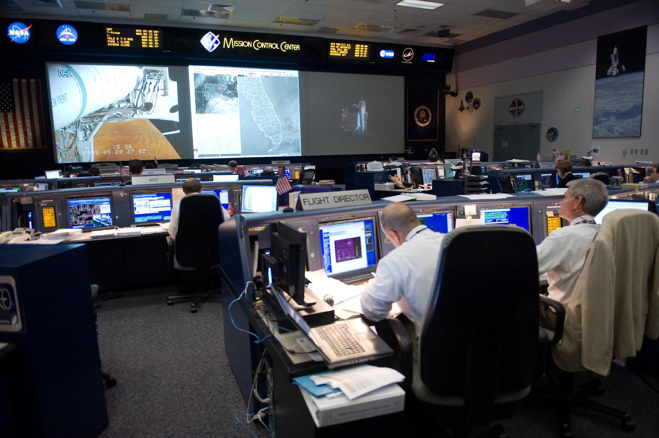 JSC2010-E-046733 (5 April 2010) --- An overall view of the space shuttle flight control room in the Johnson Space Center's Mission Control Center during launch countdown activities a few hundred miles away in Florida, site of space shuttle Discovery's STS-131 launch. In the foreground are flight directors Tony Ceccacci (left) and Bryan Lunney.