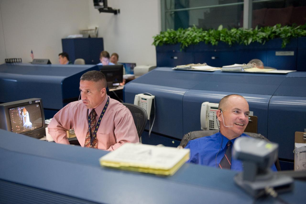 JSC2010-E-046772 (5 April 2010) --- Astronauts George Zamka (left) and Rick Sturckow, both spacecraft communicators (CAPCOM) for the STS-131 mission, are pictured at their consoles in the space shuttle flight control room in the Johnson Space Center's Mission Control Center during launch countdown activities a few hundred miles away in Florida, site of space shuttle Discovery's STS-131 launch.