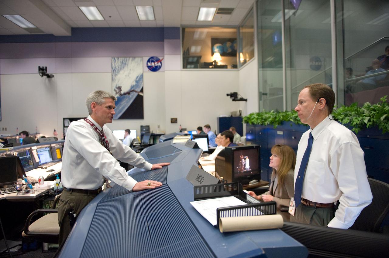 JSC2010-E-046795 (5 April 2010) --- John McCullough (right), chief of the Flight Director Office; Janet Kavandi, deputy director, Flight Crew Operations; and flight director Bryan Lunney are pictured in the space shuttle flight control room in the Johnson Space Center's Mission Control Center during launch countdown activities a few hundred miles away in Florida, site of space shuttle Discovery's STS-131 launch.