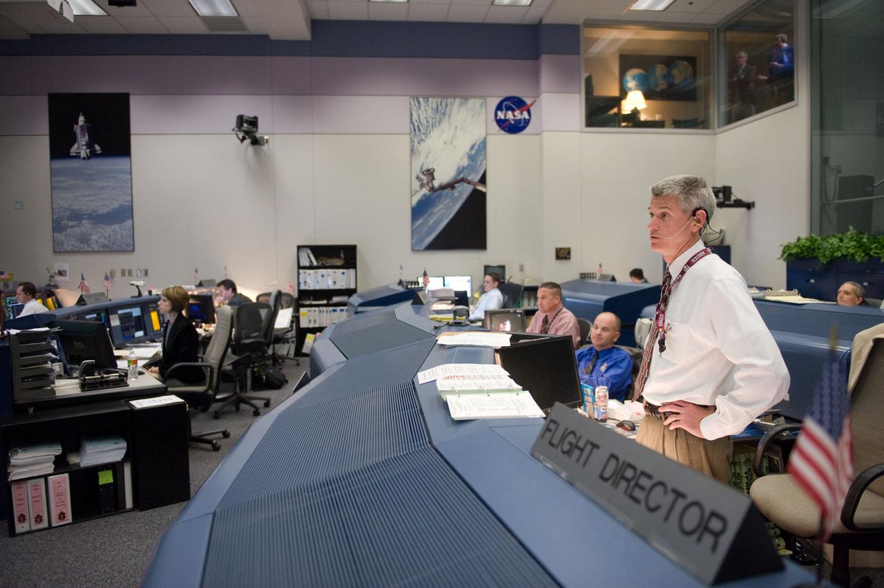 JSC2010-E-046798 (5 April 2010) --- Flight director Bryan Lunney watches the big screens in the space shuttle flight control room in the Johnson Space Center's Mission Control Center during launch countdown activities a few hundred miles away in Florida, site of space shuttle Discovery's STS-131 launch.