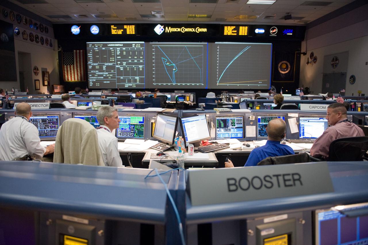 JSC2010-E-046802 (5 April 2010) --- An overall view of the space shuttle flight control room in the Johnson Space Center's Mission Control Center during launch countdown activities a few hundred miles away in Florida, site of space shuttle Discovery's STS-131 launch. Visible in the foreground (from the left) are flight directors Tony Ceccacci and Bryan Lunney; along with astronauts Rick Sturckow and George Zamka, both spacecraft communicators (CAPCOM).