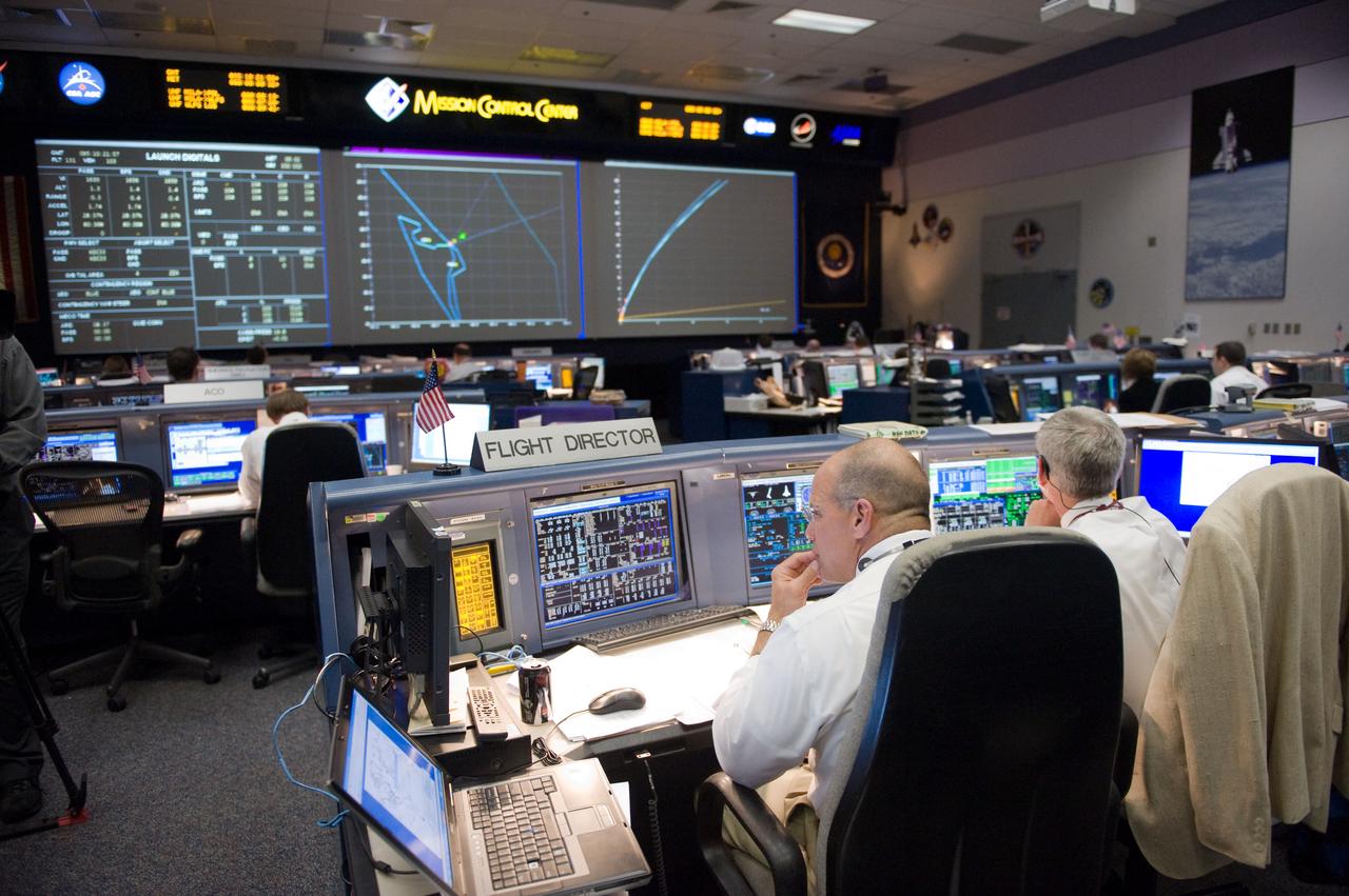JSC2010-E-046806 (5 April 2010) --- An overall view of the space shuttle flight control room in the Johnson Space Center's Mission Control Center during launch countdown activities a few hundred miles away in Florida, site of space shuttle Discovery's STS-131 launch. In the foreground are flight directors Tony Ceccacci (left) and Bryan Lunney.