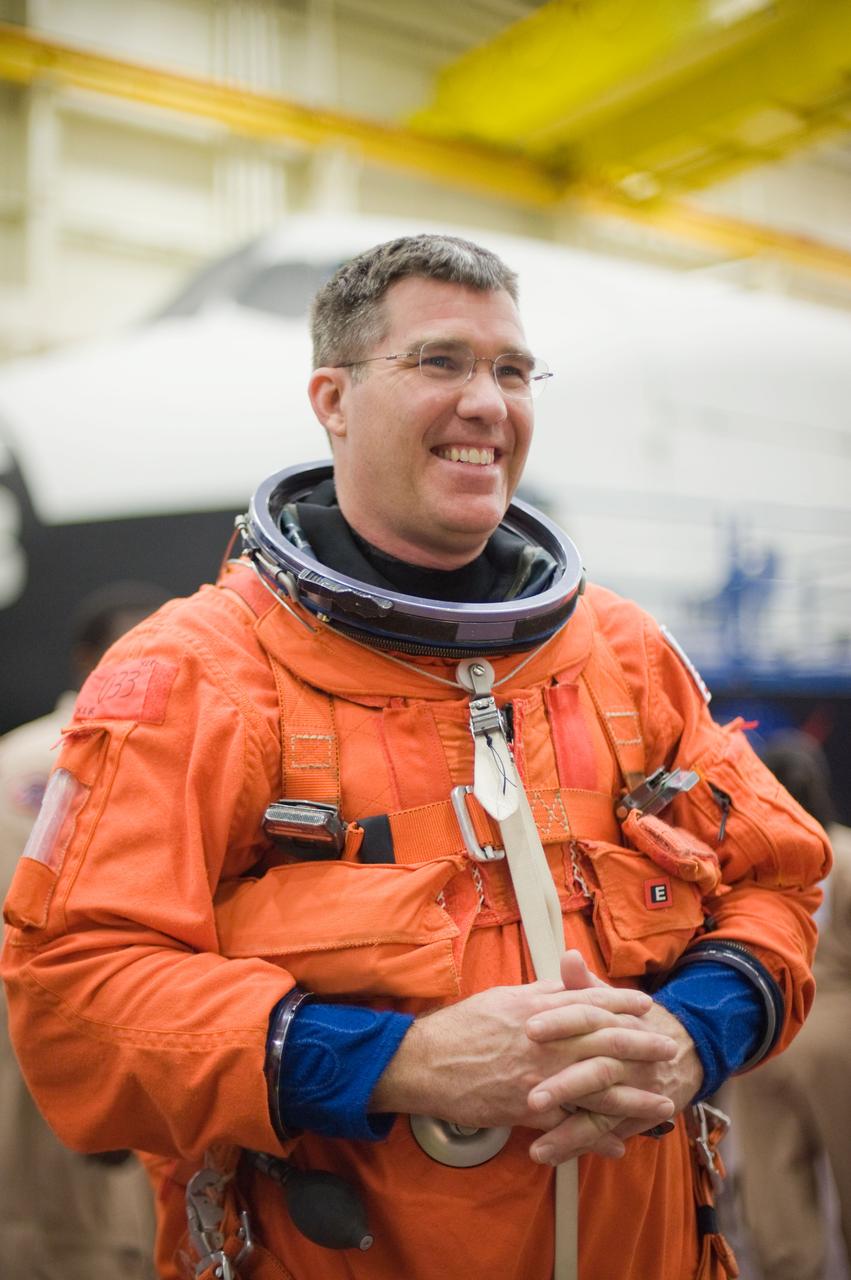 JSC2010-E-051996 (8 April 2010) --- NASA astronaut Steve Bowen, STS-132 mission specialist, attired in a training version of his shuttle launch and entry suit, awaits the start of an ingress/egress training session in the Space Vehicle Mock-up Facility at NASA's Johnson Space Center.