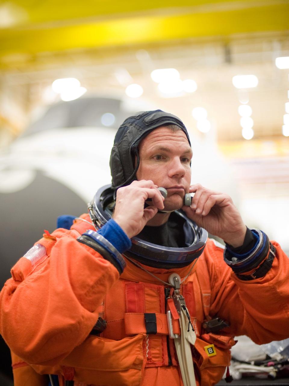 JSC2010-E-052001 (8 April 2010) --- NASA astronaut Tony Antonelli, STS-132 pilot, attired in a training version of his shuttle launch and entry suit, is pictured during an ingress/egress training session in the Space Vehicle Mock-up Facility at NASA's Johnson Space Center.