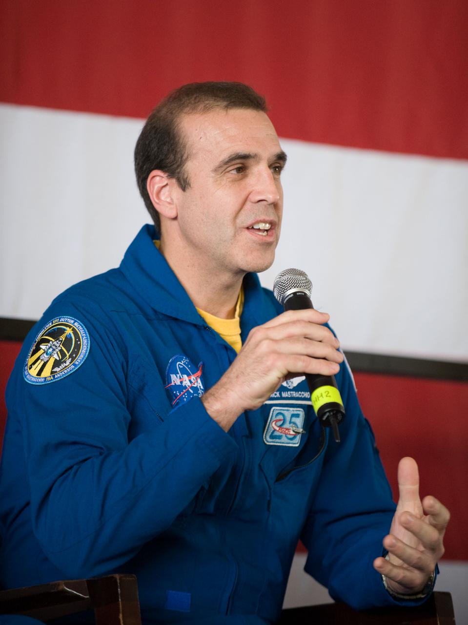 JSC2010-E-055380 (21 April 2010) --- NASA astronaut Rick Mastracchio, STS-131 mission specialist, addresses a large crowd of well-wishers at the STS-131 crew return ceremony on April 21, 2010 at Ellington Field near NASA?s Johnson Space Center.