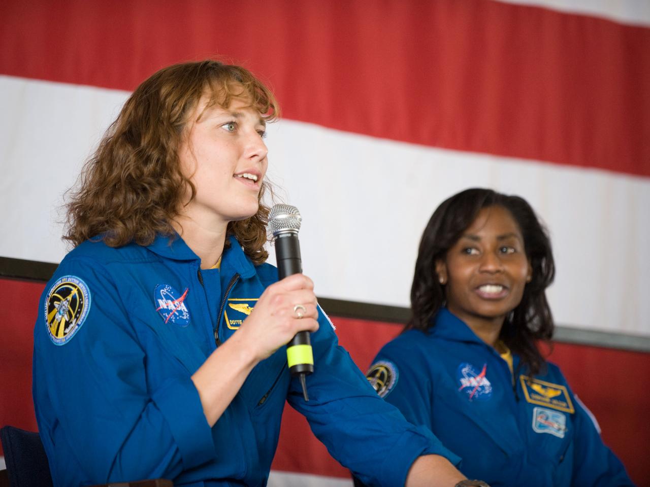 JSC2010-E-055381 (21 April 2010) --- NASA astronaut Dorothy Metcalf-Lindenburger, STS-131 mission specialist, addresses a large crowd of well-wishers at the STS-131 crew return ceremony on April 21, 2010 at Ellington Field near NASA?s Johnson Space Center. NASA astronaut Stephanie Wilson, mission specialist, is at right.