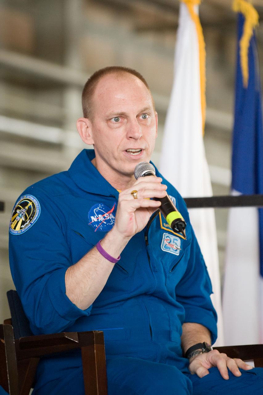 JSC2010-E-055384 (21 April 2010) --- NASA astronaut Clayton Anderson, STS-131 mission specialist, addresses a large crowd of well-wishers at the STS-131 crew return ceremony on April 21, 2010 at Ellington Field near NASA?s Johnson Space Center.