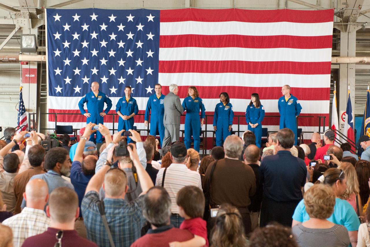 JSC2010-E-055430 (21 April 2010) --- NASA's Johnson Space Center (JSC) director Michael L. Coats (center background) and the STS-131 crew members are pictured at the STS-131 crew return ceremony on April 21, 2010 at Ellington Field near JSC. Pictured from the left are NASA astronauts Alan Poindexter, commander; James P. Dutton Jr., pilot; Rick Mastracchio, Dorothy Metcalf-Lindenburger, Stephanie Wilson, Japan Aerospace Exploration Agency (JAXA) astronaut Naoko Yamazaki and NASA astronaut Clayton Anderson, all mission specialists.