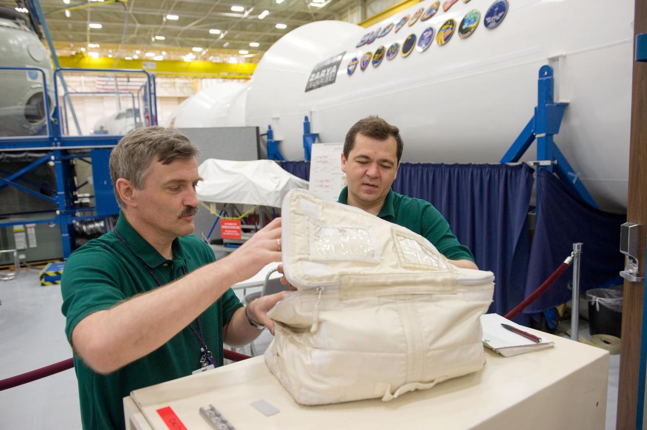 PHOTO DATE:  04-23-10 LOCATION: Bldg 9NW, ISS Mockup SUBJECT:   Expedition 25 crew members, Kaleri, Skripochka and S. Kelly during routine ops training.  PHOTOGRAPHER:  James Blair