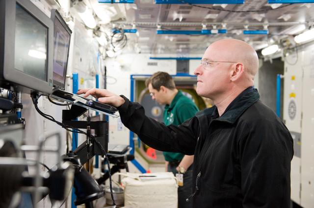 NASA image: Expedition 25 crew members, Kaleri, Skripochka and S. Kelly during routine ops training. 