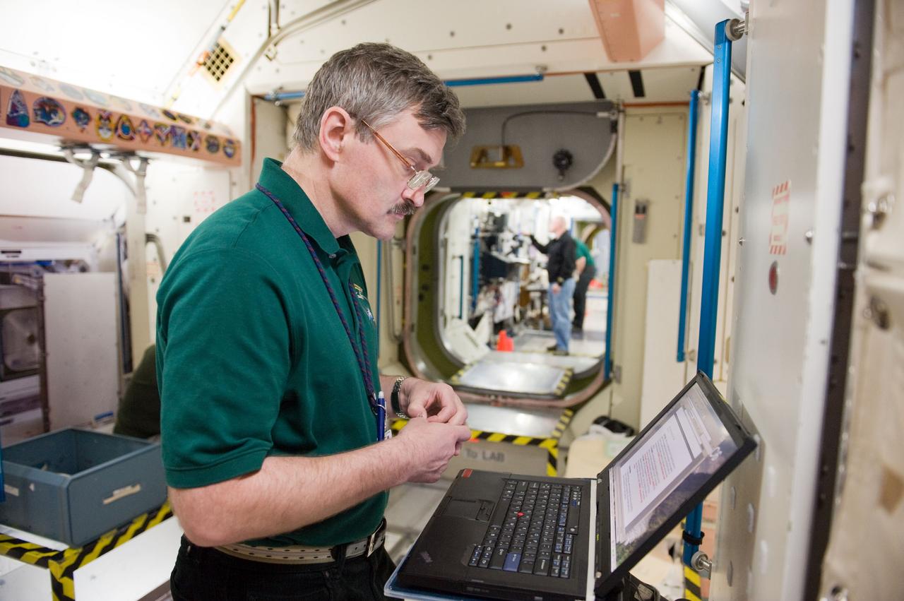 PHOTO DATE:  04-23-10 LOCATION: Bldg 9NW, ISS Mockup SUBJECT:   Expedition 25 crew members, Kaleri, Skripochka and S. Kelly during routine ops training.  PHOTOGRAPHER:  James Blair