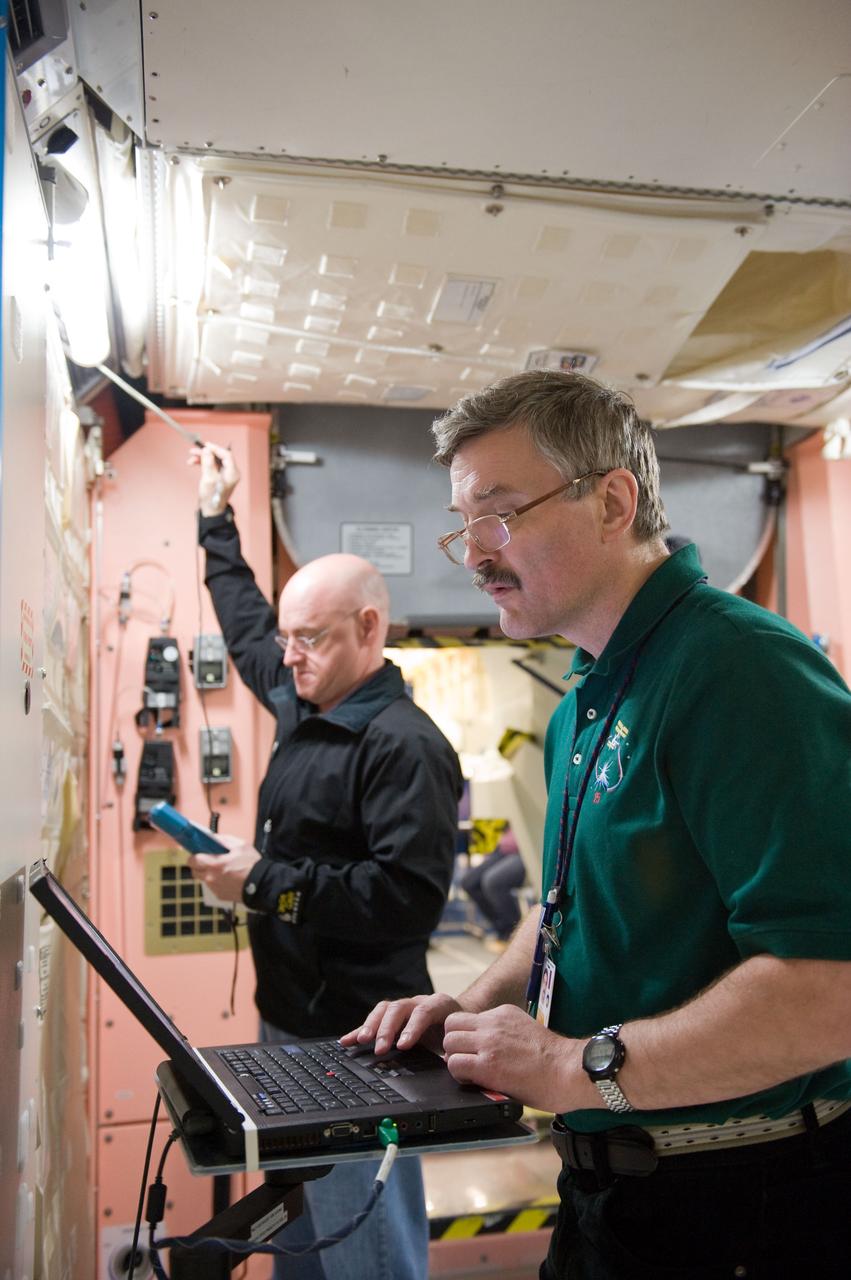 PHOTO DATE:  04-23-10 LOCATION: Bldg 9NW, ISS Mockup SUBJECT:   Expedition 25 crew members, Kaleri, Skripochka and S. Kelly during routine ops training.  PHOTOGRAPHER:  James Blair